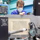 Michael Toth removes a Greek document from the beamline at Stanford Synchrotron Radiation Lightsource.